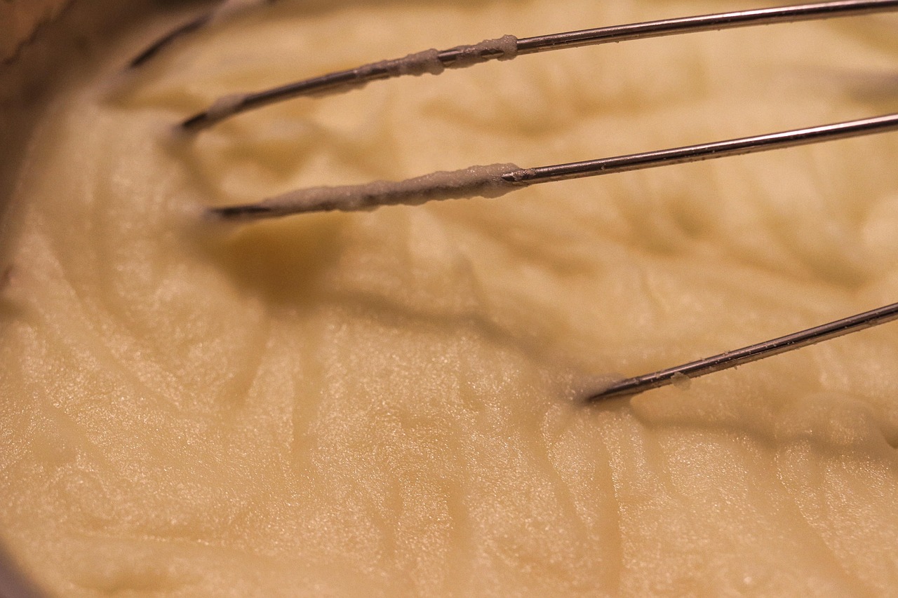 Creamy mashed potato being whisked