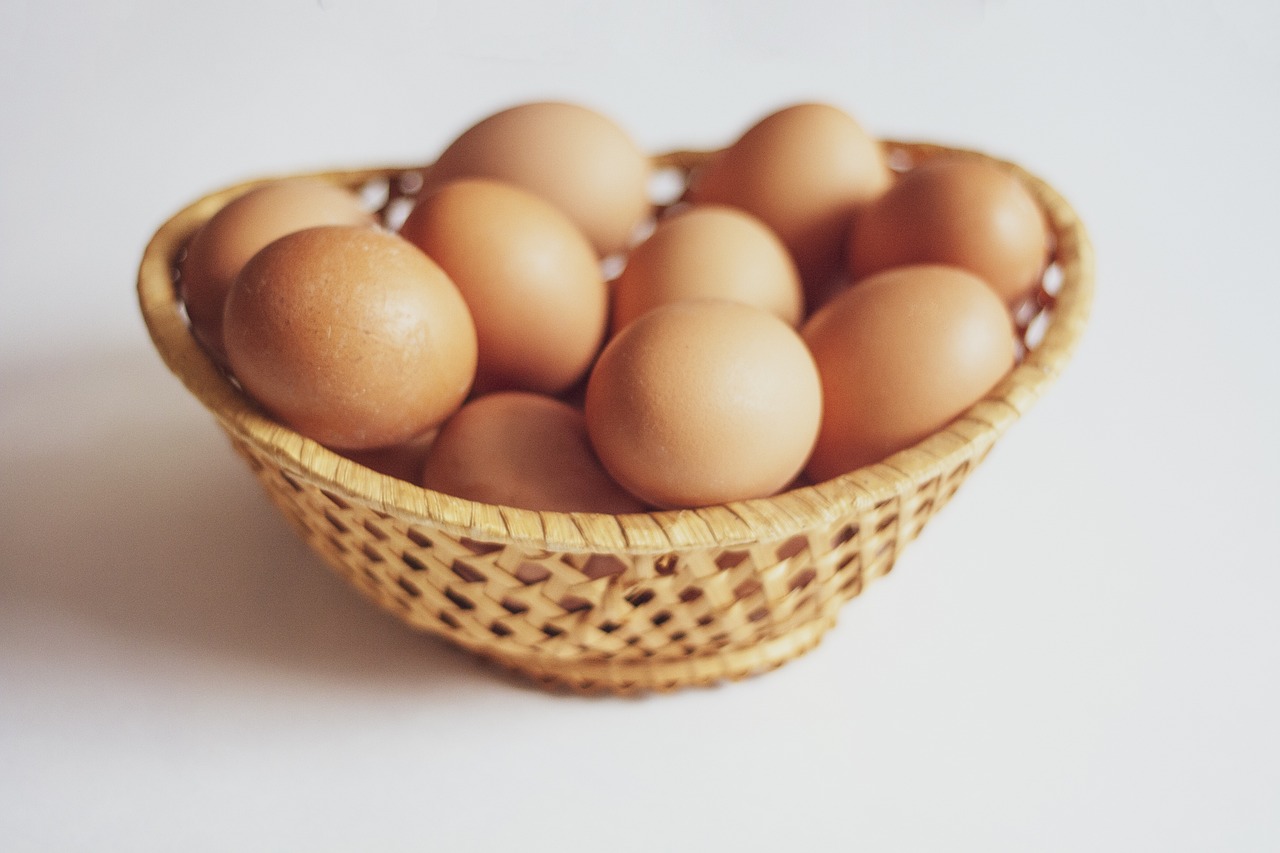 Wicker basket with fresh brown eggs, a food that is safe for celiacs